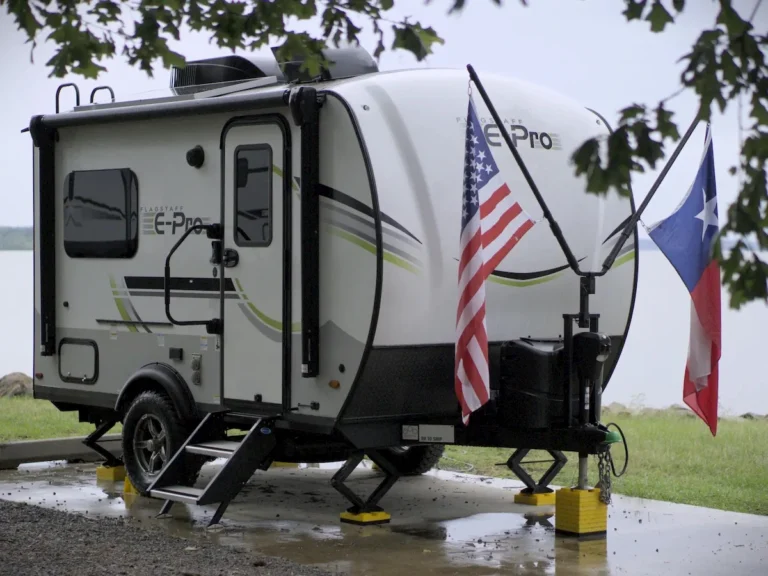 Camper parked alone at a quiet campsite where our remote storage door alerts come in handy