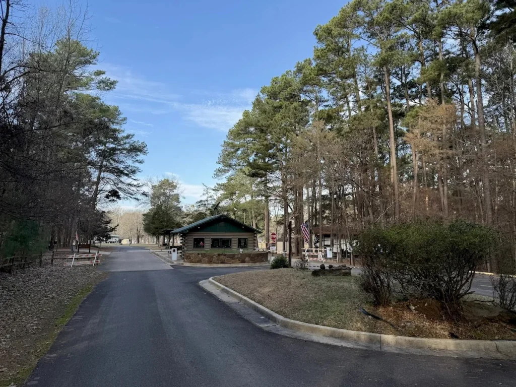 Entrance gate house at Rocky Point Park surrounded by pine trees