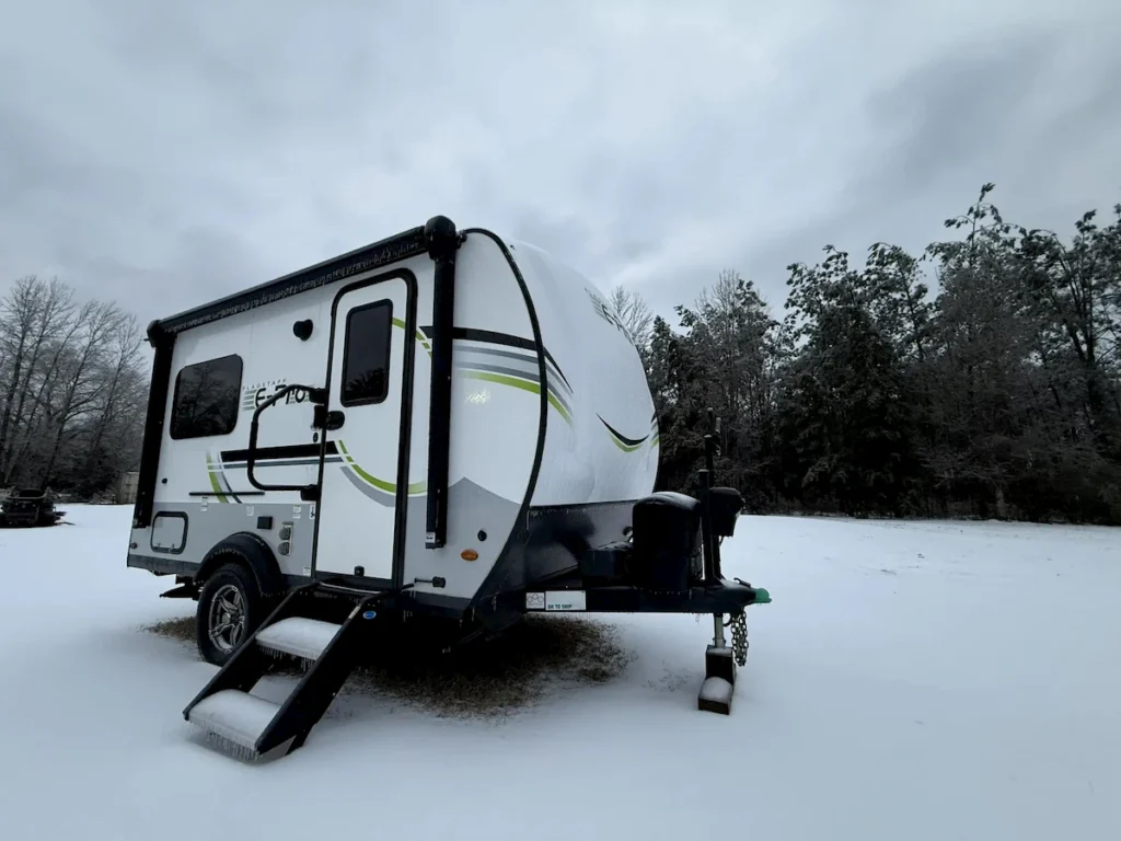 Camper covered in ice during a Texas ice storm in a driveway