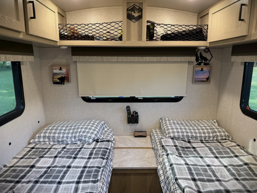 The twin bed configuration inside a 2023 Flagstaff E-Pro 15TB.