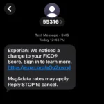 A screenshot of a mobile phone text message scam posing as an Experian FICO score alert with a phishing link to expn.pro