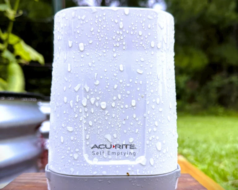 The wireless Acurite 899 rain gauge mounted outdoors as part of a custom DIY weather sensors setup.