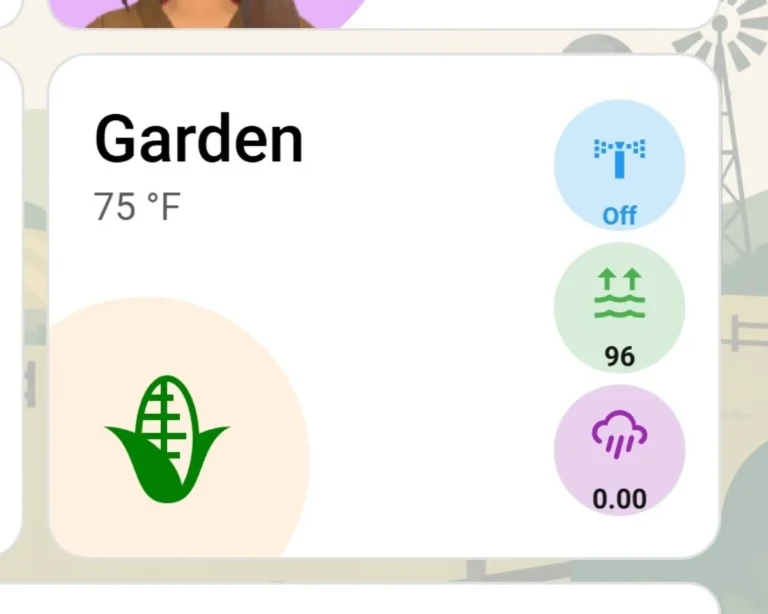 Dashboard card for my Home Assistant irrigation system displaying live ambient temperature, a smart home sprinkler switch to trigger a manual watering schedule, local humidity, and daily rain gauge metrics.