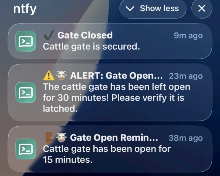 Smartphone lock screen displaying ntfy push notifications for cattle gate monitor status updates while having lunch 200 miles away from home.